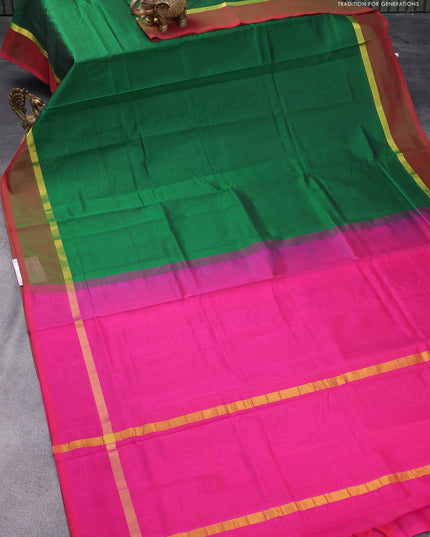 Silk cotton saree green and pink with plain body and zari woven simple border