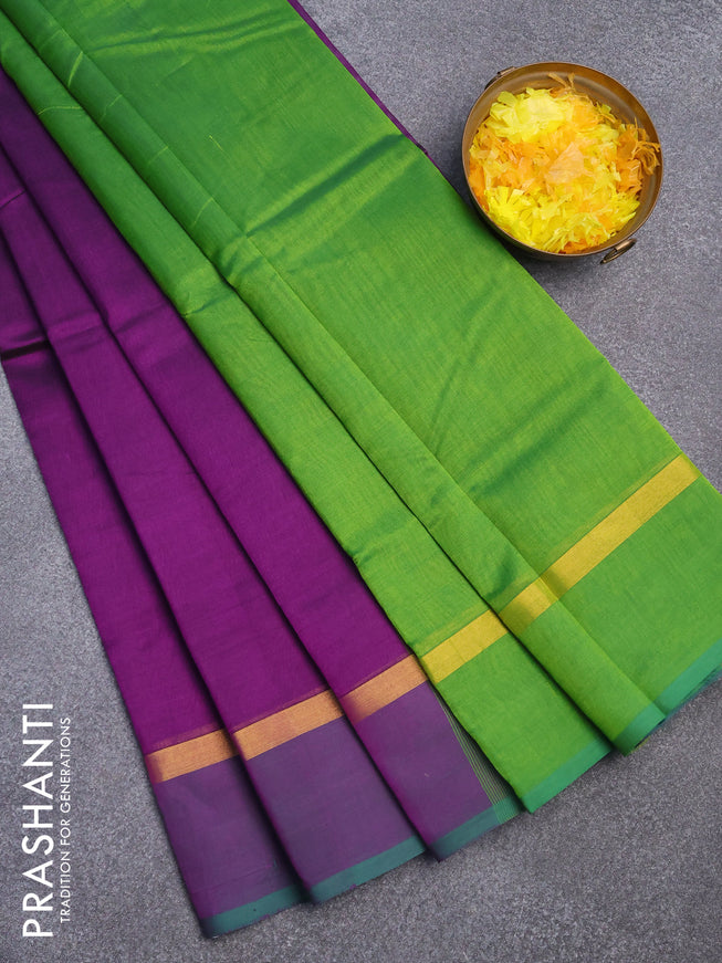 Silk cotton saree deep purple and light green with plain body and zari woven simple border