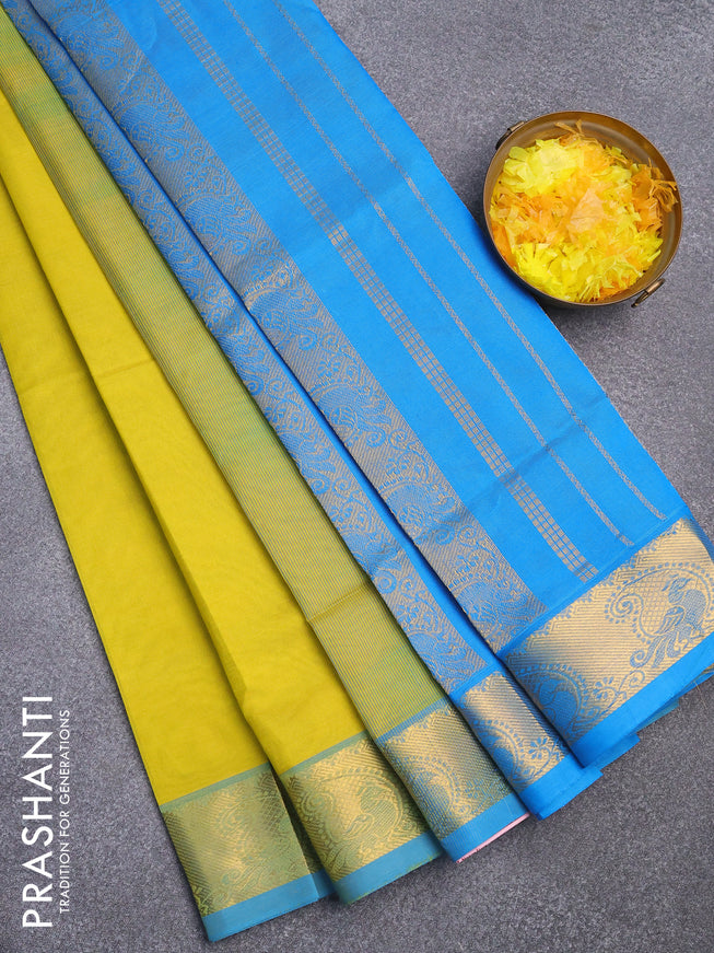 Silk cotton saree lime yellow and light blue with plain body and zari woven border