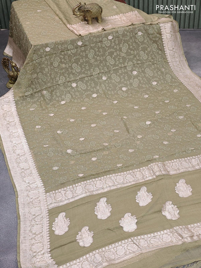 Banarasi chiffon silk saree elaichi green shade with allover chikankari work & silver zari buttas and silver zari woven border - {{ collection.title }} by Prashanti Sarees