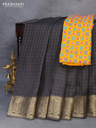 Dola silk saree black and yellow with zari checked pattern and zari woven border with embroidery work blouse