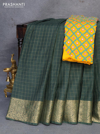 Dola silk saree bottle green and yellow with zari checked pattern and zari woven border with embroidery work blouse