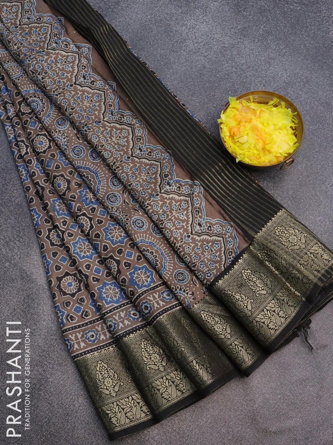 Dola silk saree chiku shade and black with allover ajrakh prints and zari woven floral border - {{ collection.title }} by Prashanti Sarees