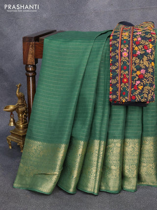 Dola silk saree green and black with allover zari woven stripes pattern and zari woven border with embroidery work blouse