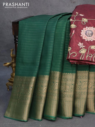 Dola silk saree green and maroon with allover zari woven stripes pattern and rich zari woven border