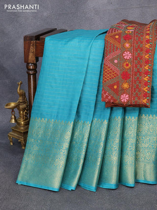 Dola silk saree teal blue and brown with allover zari woven stripes pattern and long zari woven border with embroidery work blouse
