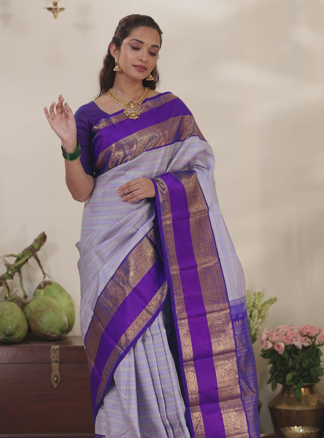 Pastel grey-Violet Pure Kanchipuram silk saree with allover stripes pattern & long zari woven border