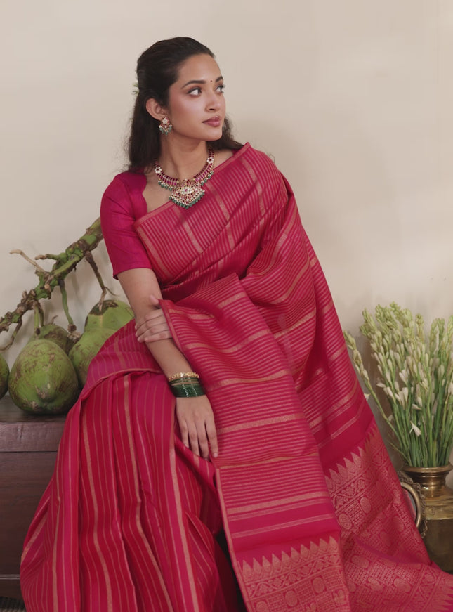 Pink pure kanchipuram silk saree with allover zari stripes pattern & in borderless style