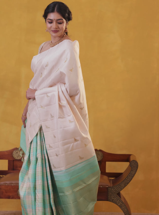 Off white-Teal blue Pure Kanchipuram silk saree With Zari woven peacock buttas