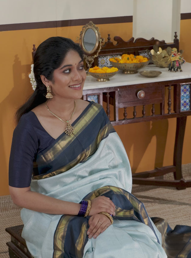 Pastel blue-Navy blue Pure Kanchipuram Silk Saree With allover zari woven brocade weaves and Reattapet zari woven border