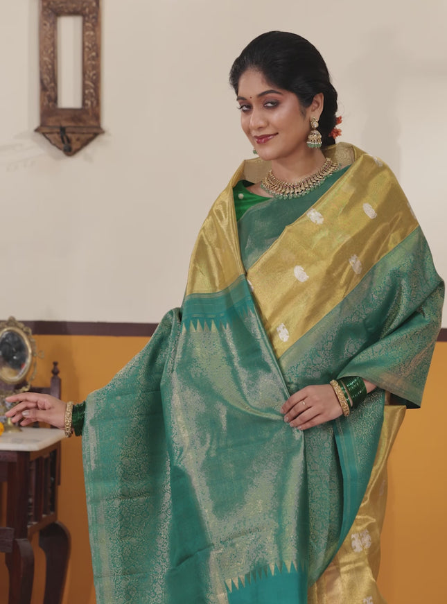 Gold-Peacock blue Pure Tissue Kanchipuram Silk Saree With Silver zari buttas & Long rich zari border