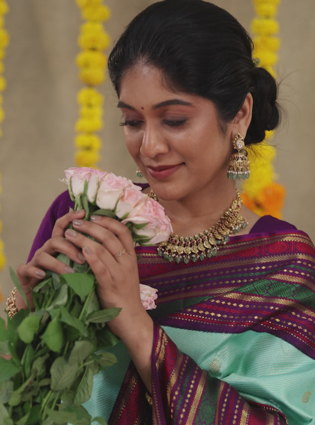 Teal -purple Pure kanchipuram silk saree with allover zari weaves & long zari woven border