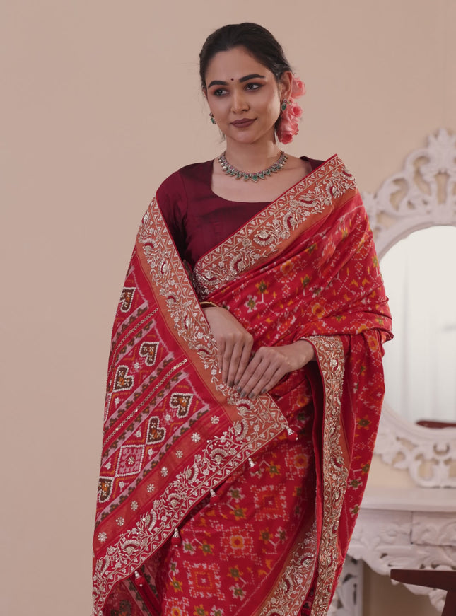 Red Pochampally silk saree with allover ikat weaves and Embroidered border