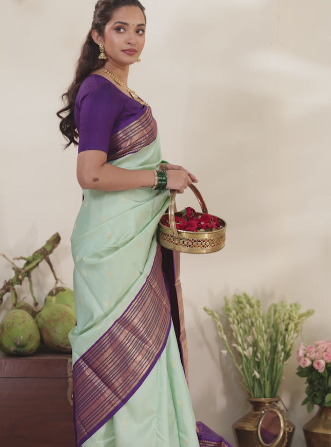 Pastel Green-Purple Pure kanchipuram silk saree with allover zari weaves & buttas and long zari woven border