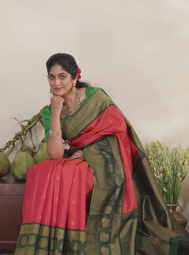 Pinkish orange-Green Pure kanchipuram silk saree with zari woven buttas & long zari woven border
