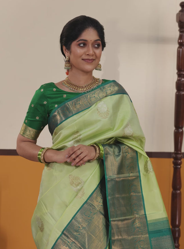 Pista green-Peacock blue Pure kanchipuram silk saree with zari woven buttas & Long rich zari woven border