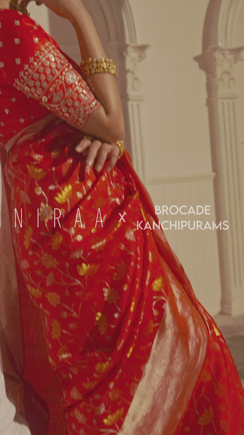 Pure kanchipuram silk saree reddish pink with floral motif zari weaves and silver zari woven border