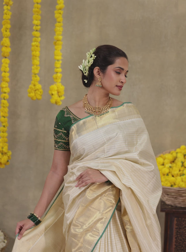Cream-Green Pure kanchipuram silk saree with silver & gold zari woven stripes pattern and long zari woven border