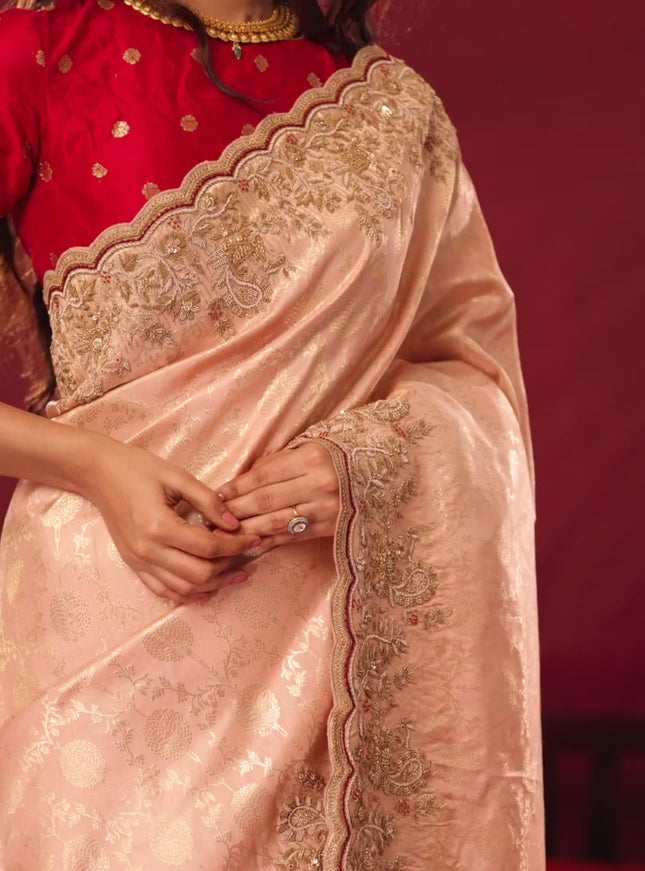 Pastel pink pure kanchipuram silk saree with allover weaves & border embroidery