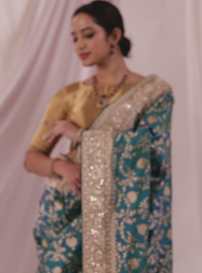 Teal Blue Banarasi Uppada silk saree with allover zari weaves & embroidery border