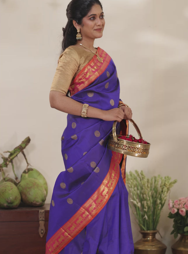 Blue-Dual shade of pinkish orange pure kanchipuram silk saree with zari woven buttas & zari woven border
