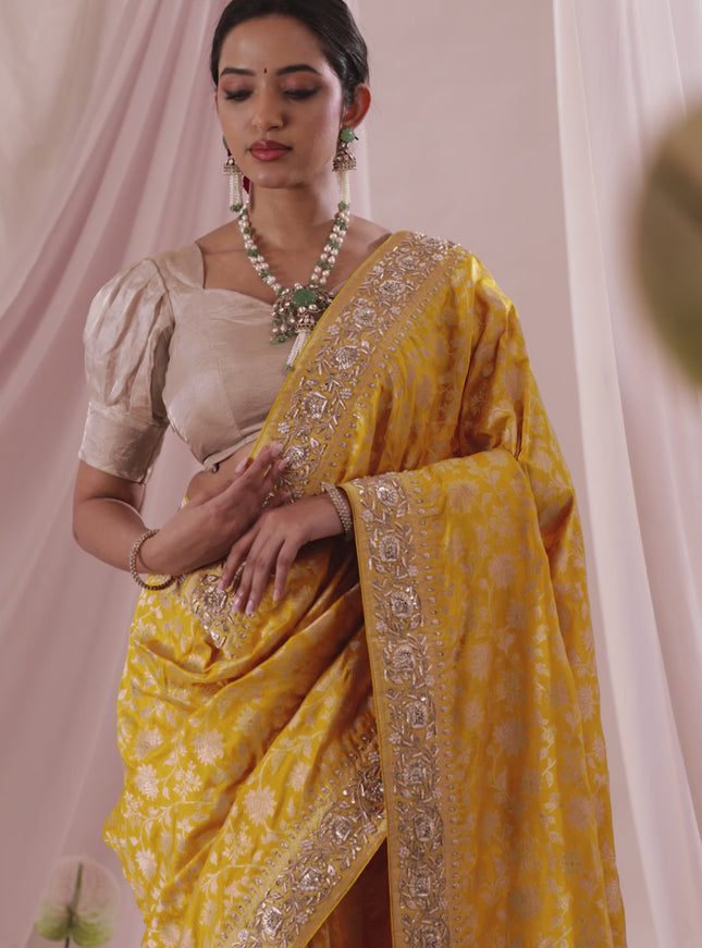 Mango yellow Banarasi Uppada silk saree with allover zari weaves & embroidery border