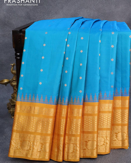 Pure gadwal silk saree dual shade of blue and mustard yellow with allover zari woven buttas and temple design long zari woven border - {{ collection.title }} by Prashanti Sarees