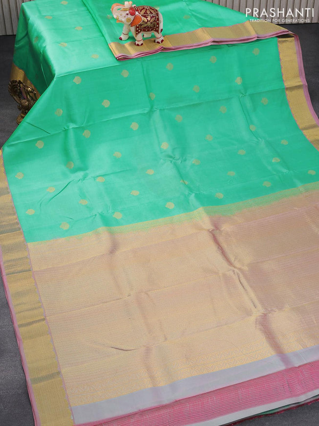 Green Budget Silk Saree, Prettified with Zari Buttas All Over Its Body, Complemented by a Contrast Traditional Zari Border of Floral Creeper Designs, Pallu of Ogee Patterns, and Paired with a Contrast Blouse main image 1