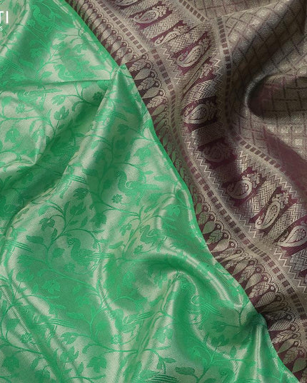 Pure kanjivaram tissue silk saree teal green and deep maroon with allover silver zari woven brocade weaves and long rich silver zari woven peacock design border & embroidery work blouse - {{ collection.title }} by Prashanti Sarees