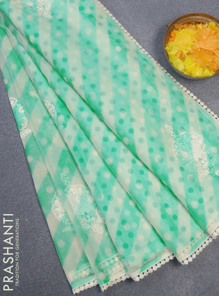 Semi orangza saree off white and teal blue with allover ikat prints & embroidery buttas and crocia lace border - {{ collection.title }} by Prashanti Sarees