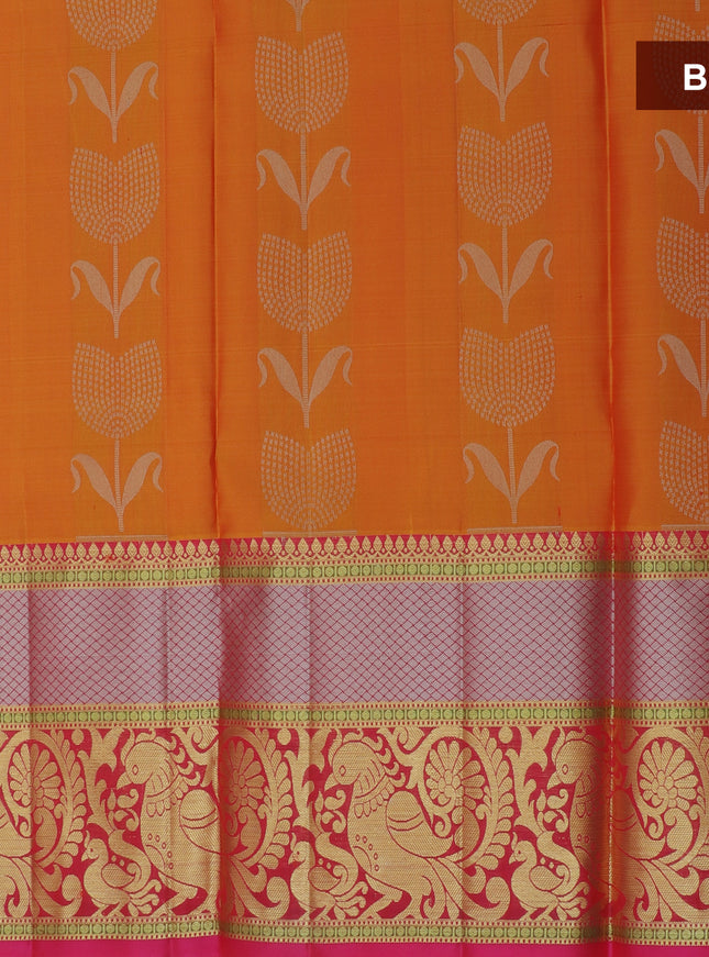 Pure silk half saree mango orange with allover silver zari floral buttas and contrast dark pink blouse & Dupatta
