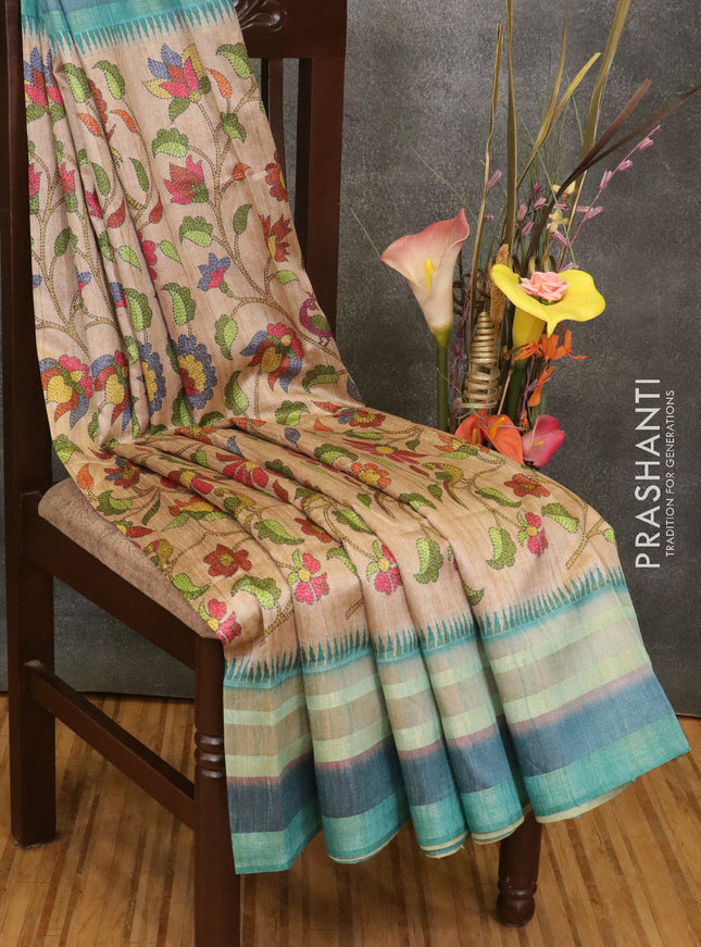 Semi linen saree beige and teal blue with allover floral prints and simple border