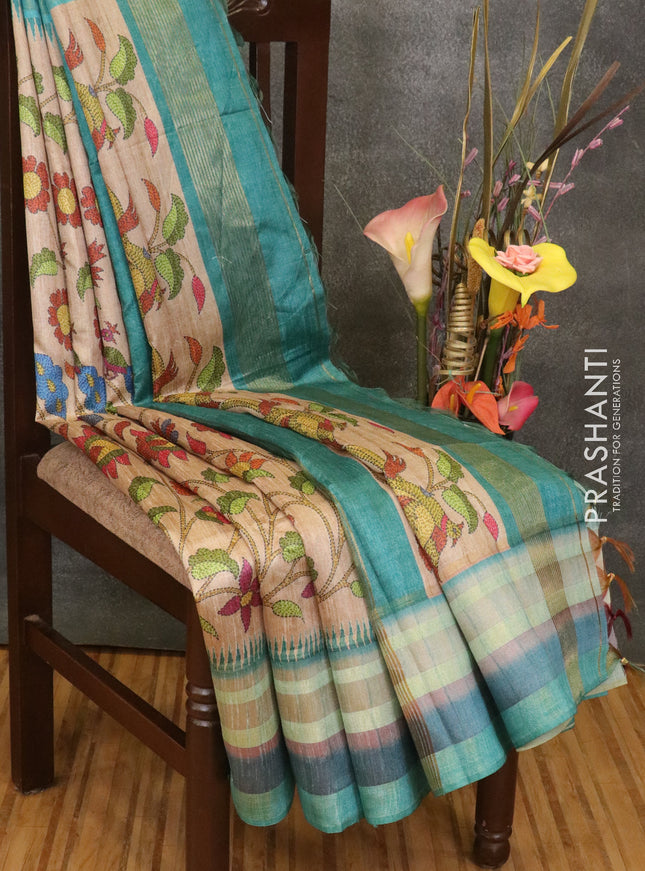 Semi linen saree beige and teal blue with allover floral prints and simple border