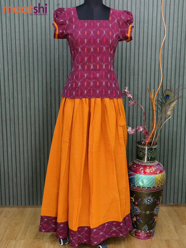 Cotton kids lehanga purple shade and mango yellow with allover ikat butta weaves and back knot & simple border for 15 years - {{ collection.title }} by Prashanti Sarees