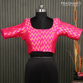 Readymade brocade blouse candy pink with allover ikat zari weaves and back knot