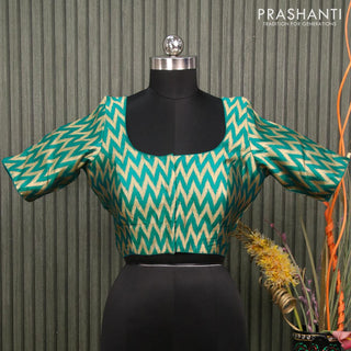 Readymade brocade blouse teal blue with allover ikat zari weaves and back knot