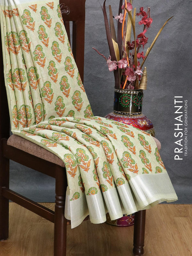 Tissue linen saree pista green with allover floral butta prints and silver zari woven border - {{ collection.title }} by Prashanti Sarees