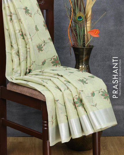 Tissue linen saree pista green with allover floral prints and silver zari woven border - {{ collection.title }} by Prashanti Sarees