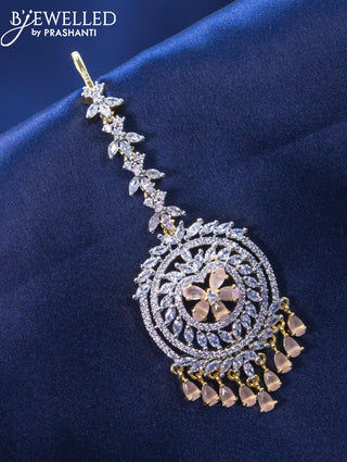 Zircon maang tikka with baby pink and cz stone in gold finish