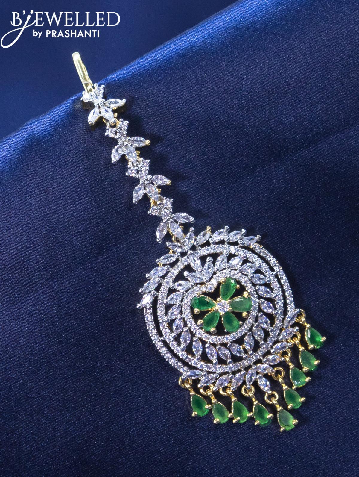 Zircon maang tikka with emerald and cz stone in gold finish